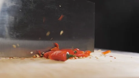 Hand cuts red hot pepper Stock Footage 118470588