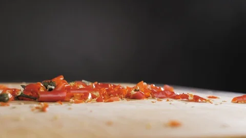 Hand cuts red hot pepper Video stock 118470606