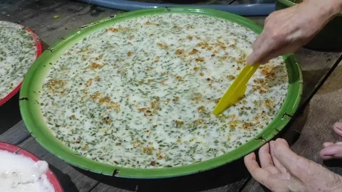 A hand is cutting cake from a tray Stock Footage 268352865