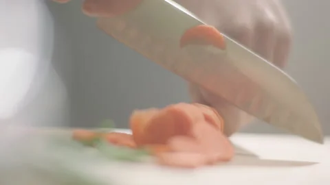 Hand cutting carrots on the table Video stock 200937700