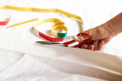 Hand Cutting Cloth with Scissors Stock Photos