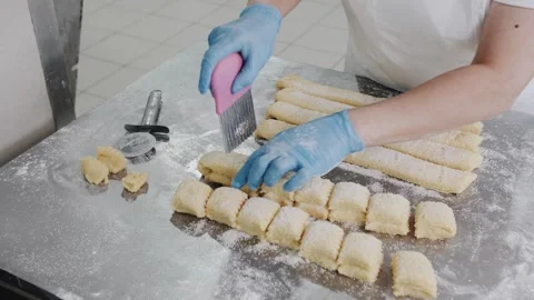 Hand Cutting Cookie Dough Before Baking, Dough with sugar. Bakery production Stock Footage 321544969