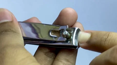 Hand Cutting Fingernails with Nail Clipper Close Up Stock Footage 326641354