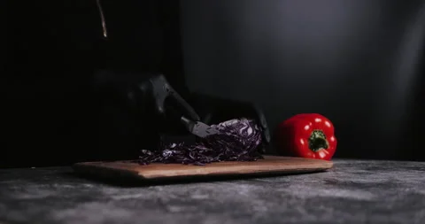 Hand cutting fresh red cabbage on Cutting Board Video stock 148245408