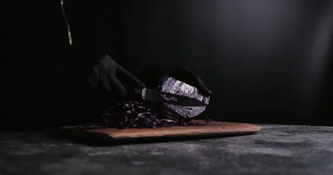 Hand cutting fresh red cabbage on Cutting Board Video stock 148245478