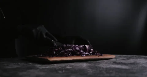 Hand cutting fresh red cabbage on Cutting Board Video stock 148245534