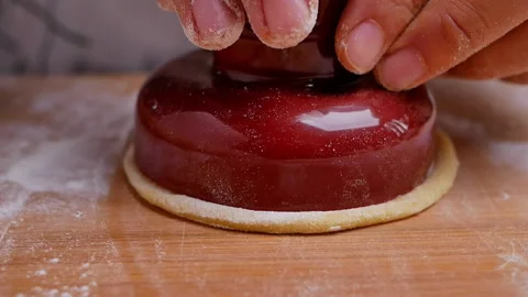 Hand cutting homemade dough with plastic cutters and cut circles out of it. Stock Footage 158092425