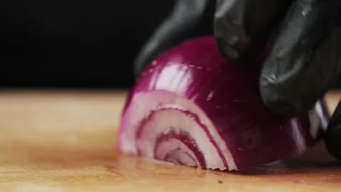 Hand cutting onion with a knife, close-up. Stock Footage 151645358