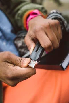 Hand cutting a pencil Stock Photos