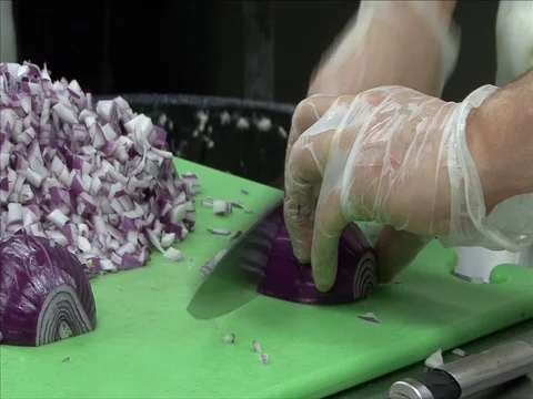 Hand cutting red onions Stock Footage 124386195