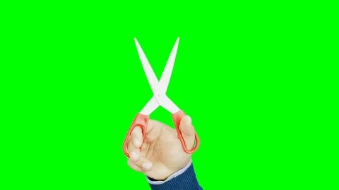 Hand cutting with scissors isolated green screen Stock Footage 76509435