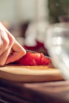 Hand Cutting Tomato on plate, Stock Photos