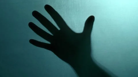 Hand in dark blue background Stock Footage 310941935