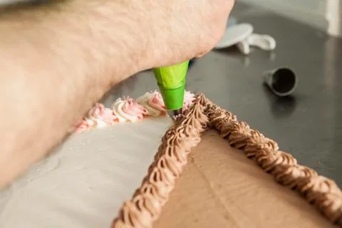 Hand Decorating Cake Stock Photos