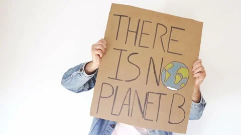 Hand with denim jacket waving there is no planet b sign over white background Stock Footage 165660346