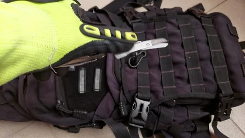 Hand deploying spring action scissors on heavy duty multitool, close up top view Video stock 346363970