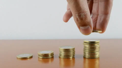 Hand depositing a coin concept of saving Vidéo 37818462