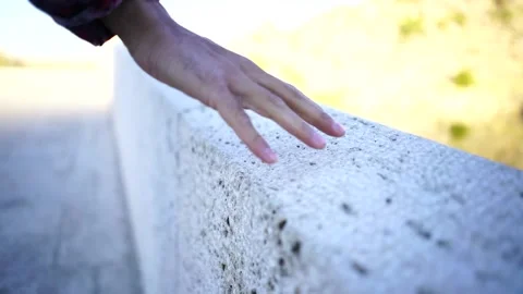 Hand detail touching the stone Stock Footage 144975916