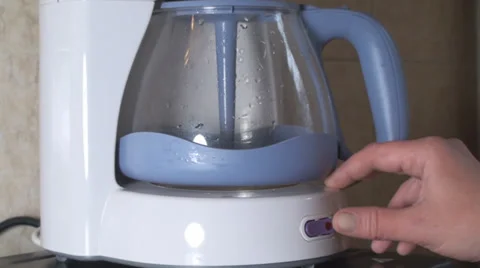 Hand Detail Turning On A Coffee Maker Stock Footage 34386793