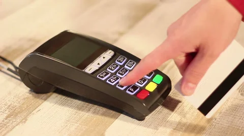 Hand dialing pin code and making transaction using pos terminal Stock Footage 65392415