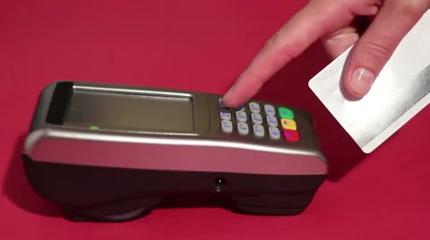 Hand dialing pin code on pin pad of pos terminal and swipe credit card Stock Footage 65396177