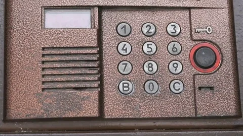 Hand dials number of apartment on intercom system Stock Footage 69212080