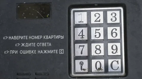 Hand dials number of apartment on intercom system Stock Footage 69213595
