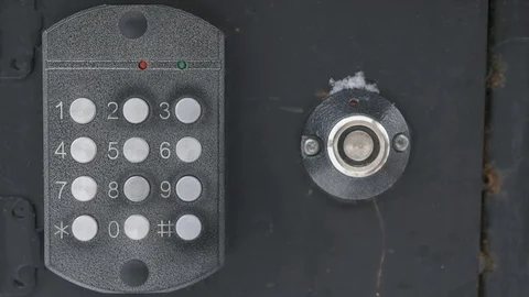 Hand dials number of apartment on intercom system Stock Footage 70216964