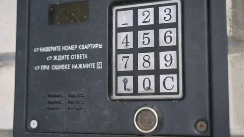 Hand dials number of apartment on intercom system Stock Footage 70217207