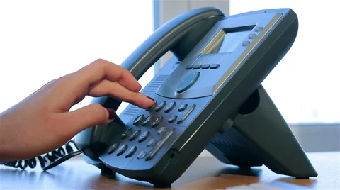 Hand dials the number on the telephone Stock Footage 51167436