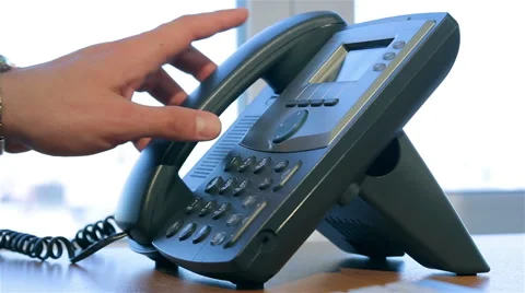 Hand dials the number on the telephone Stock Footage 51167512