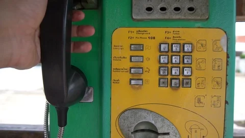 Hand dials the number on the telephone Stock Footage 113589288