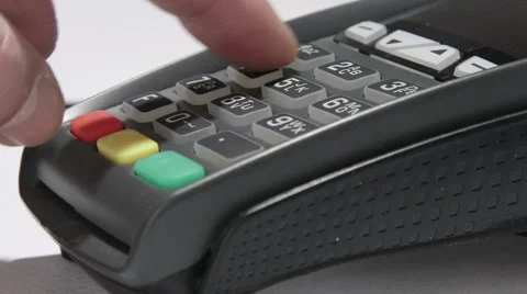 Hand dials the pin code into credit card reader Stock Footage 47863976