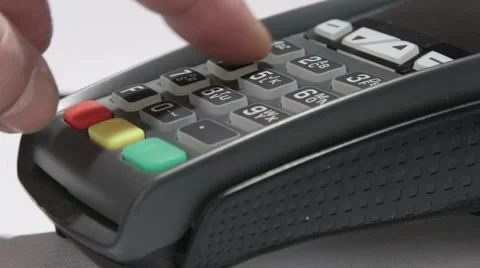 Hand dials the pin code into credit card reader Stock Footage 47864450