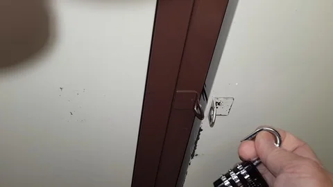 Hand dials a secret code on padlock Stock Footage 119578857