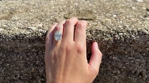 Hand with diamond engagement ring on stone wall in Croatia Video stock 319694015