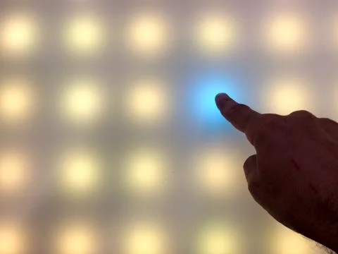 Hand on digital art dot touch screen Stock Photos