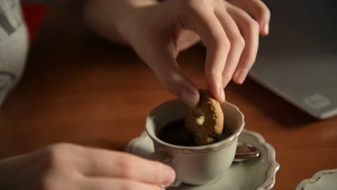 Hand dip cookie in cup of coffee Stock Footage 156756163