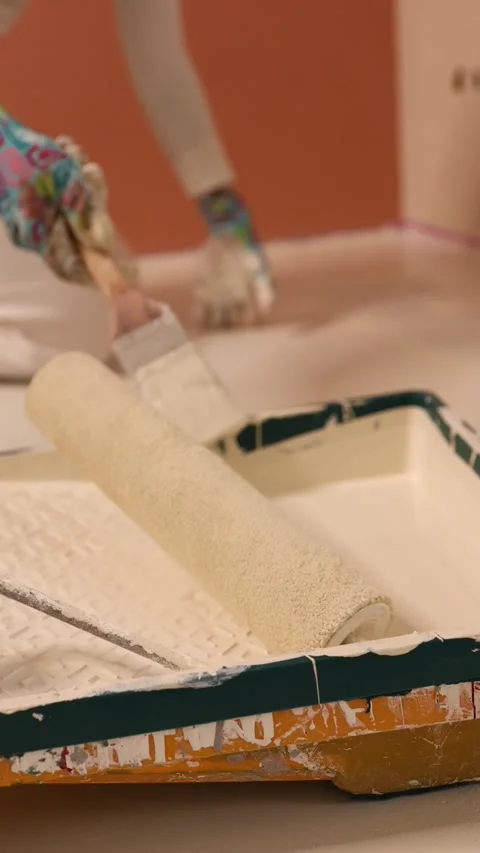 Hand Dipping Brush Into Paint Tray Roller Stock Footage 345780133