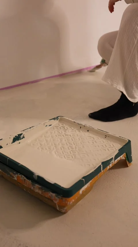 Hand Dipping Brush Into White Paint Tray Stock Footage 345780105
