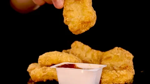 Hand Dipping Crispy Chicken Nugget in Barbecue Sauce Vídeos de archivo 313269957