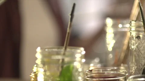 Hand dipping a paintbrush into paint Stock Footage 56237151