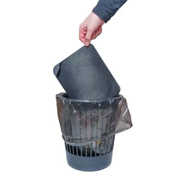 Hand Discards Worn Mouse Pad into a Trash Bin Stock Photos