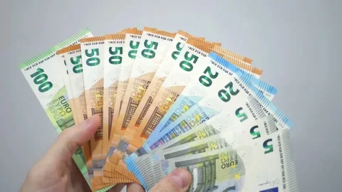 Hand displaying assorted Euro banknotes in a fan arrangement Stock Footage 287034683