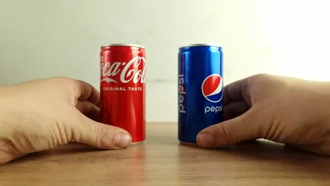 Hand displaying cans of Pepsi and Coca C... | Stock Video | Pond5