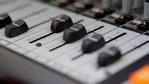 Hand of a dj mixing sound in an equalizer, turning up the volume of a sound Stock Footage 306971449