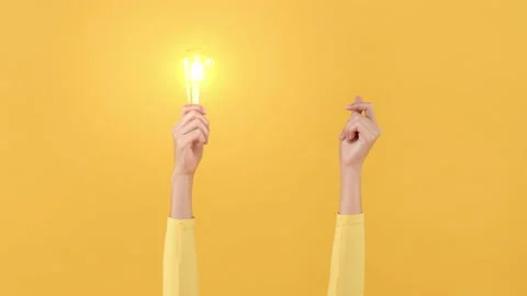Hand doing finger snapping to turn on light bulb for creative and idea concept Stock Footage