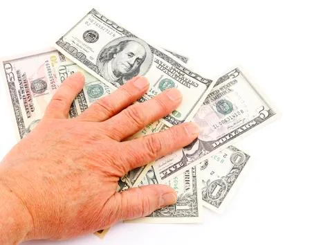 Hand on dollars Stock Photos