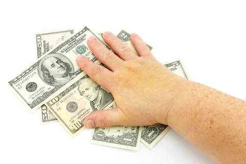 Hand on dollars Stock Photos