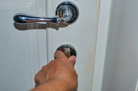 Hand on a door lock Stock Photos
